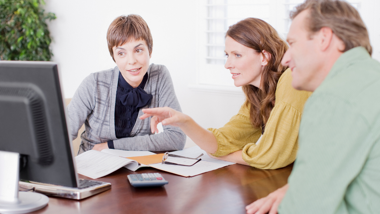 An L&R Block advisor meeting with a couple